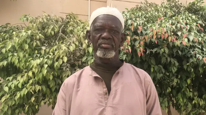 Mallam Muhammadu Sani for front of im mosque