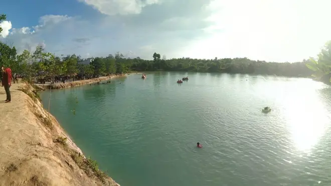 "Danau Biru" adalah lubang bekas tambang di Kabupaten Paser yang dijadikan objek wisata oleh masyarakat setempat.