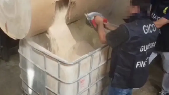 Italian police inspect tubs containing counterfeit Captagon pills