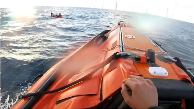 A lifeboat was launched and found the man with his legs dangling over the side of the £10 toy dinghy.