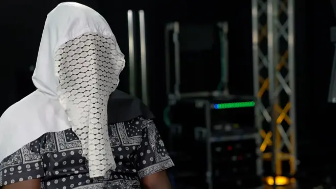 Man wey wear a mask and a hood