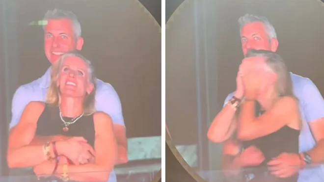 Кристин Кэбот и Энди Байрон обнимаются и прячутся от камеры на концерте