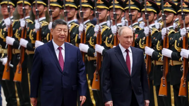 Russian President Vladimir Putin and Chinese President Xi Jinping inspect an honor guard during a welcoming ceremony at the Great Hall of the People in Beijing, China May 20, 2026.