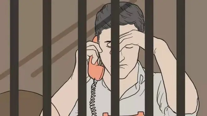 కటకటాల వెనుక యువకుడి చిత్రం