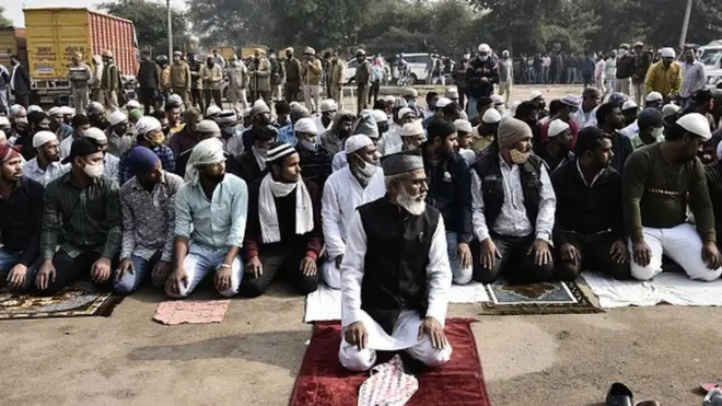Muslim devotees offer Namaz at Sector 37 parking area amidst protests, on December 3, 2021 in Gurugram, India. Heavy police deployment was made to avoid any untoward incident.