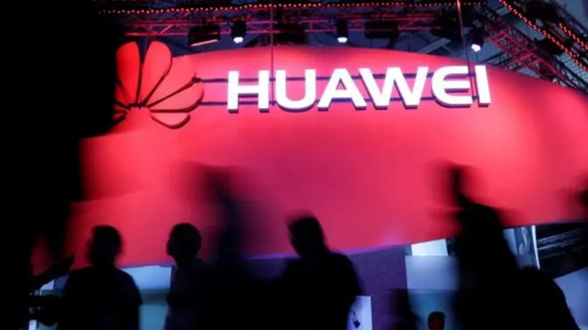 Visitors walk past Huawei"s booth during Mobile World Congress in Barcelona, Spain, February 27, 2017. REUTERS/Eric Gaillard/File Photo