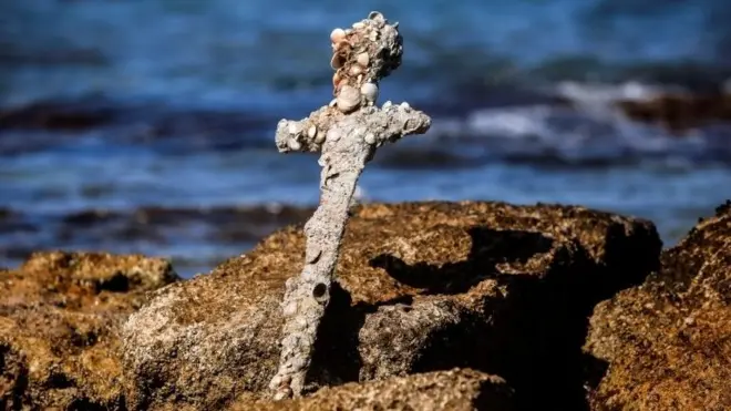 A sword believed to have belonged to a Crusader who sailed to the Holy Land almost a millennium ago was found in Caesarea