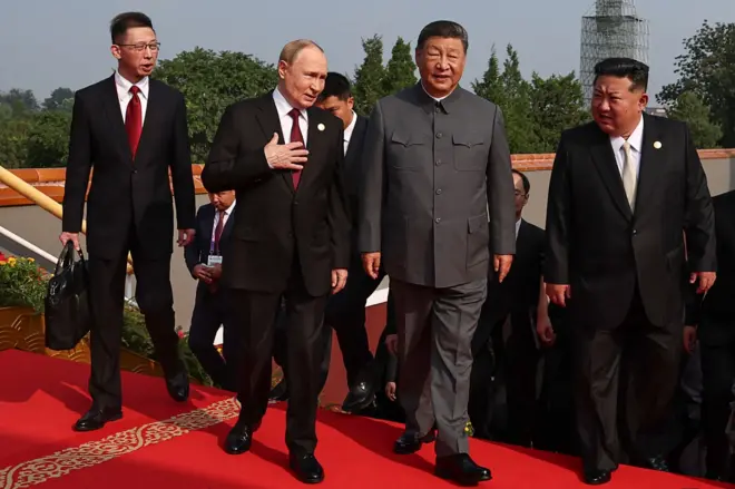 In this pool photograph distributed by the Russian state agency Sputnik, (2nd L-R) Russia's President Vladimir Putin walks with China's President Xi Jinping and North Korea's leader Kim Jong Un before a military parade marking the 80th anniversary of victory over Japan and the end of World War II, in Beijing's Tiananmen Square on September 3, 2025