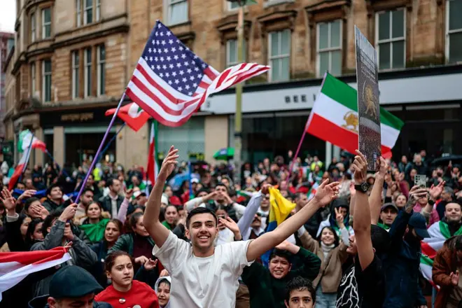 Members of the Iranian community take part in celebrations following the U.S. and Israeli strikes on Iran on March 01, 2026 in Glasgow, Scotland. Iran's Supreme Leader, Ayatollah Ali Khamenei, was confirmed killed after the United States and Israel launched a joint attack on Iran on February 28.