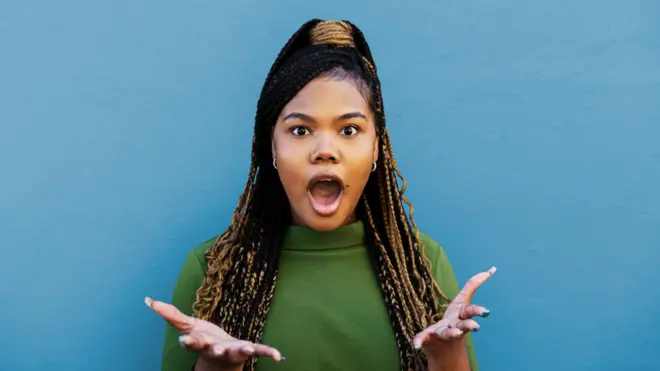 A woman with a surprised face