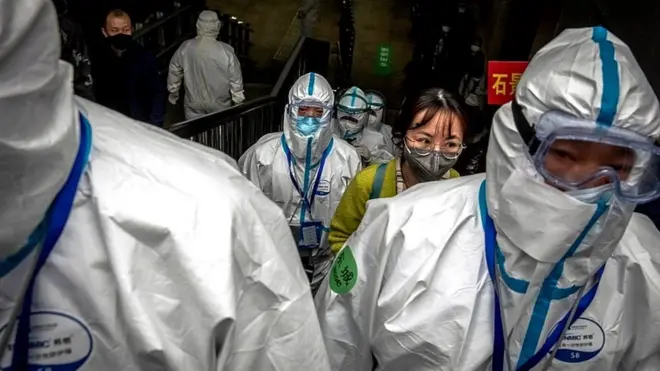 Train passengers arrive from Wuhan