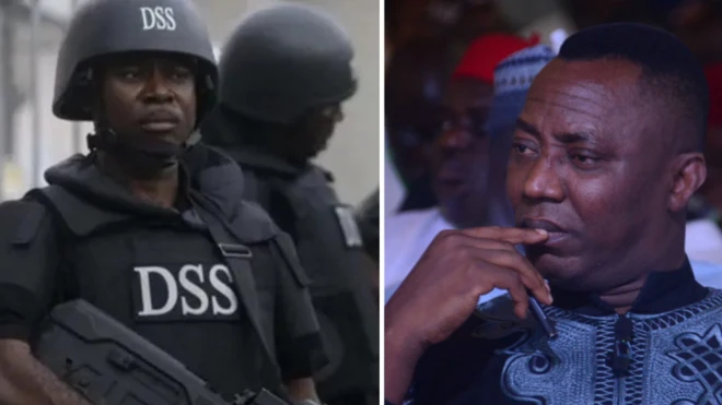 Man wey wear black and helmet wit DSS for front, Sowore touching im lip looking at di camera