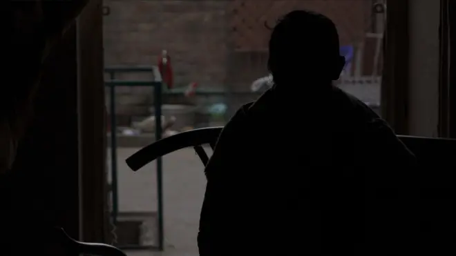 A sex worker is speaking to BBC at her home in Lahore