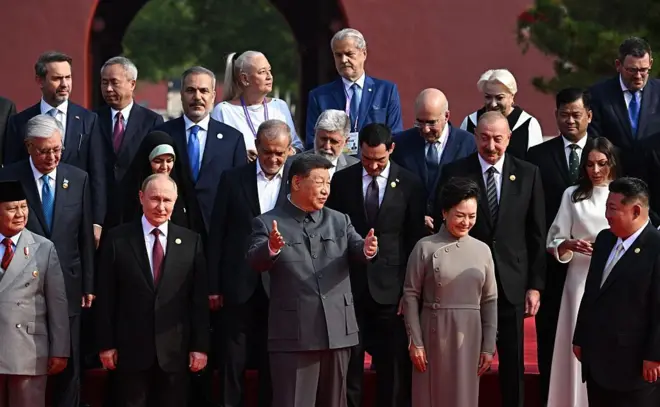Leaders pose for a family photo as they arrive for a reception in the Great Hall of the People, following a military parade marking the 80th anniversary of victory over Japan and the end of World War II, in Beijing on September 3, 2025