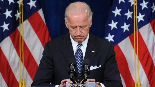 Joe Biden looks down