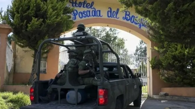 Mexican soldiers guard the funeral of Ocampo municipality Mayor and candidate for the Democratic Revolutionary Party (PRD), Fernando Angeles, in Ocampo, Michoacan State, Mexico, on June 21, 2018.