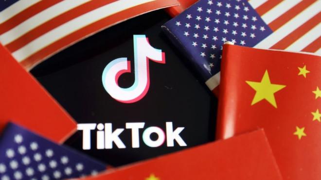 China and US flags are seen near a TikTok logo