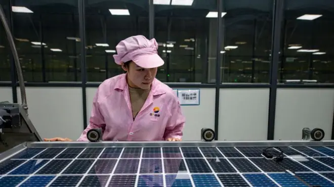 An employee works on the production line of solar panels at a factory on February 14, 2023 in Jinhua, Zhejiang Province of China.