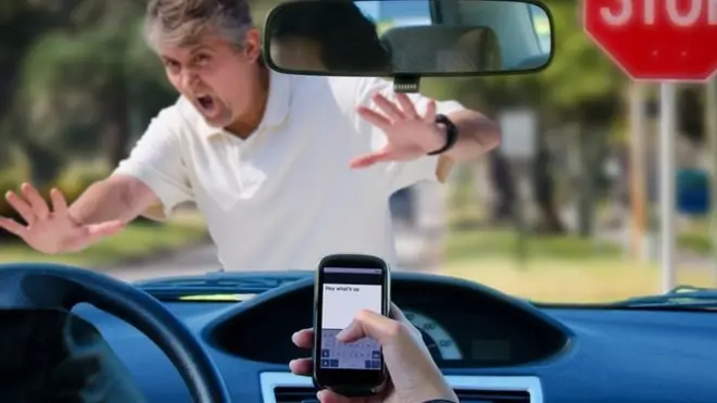 Driver on mobile phone nearly running someone over