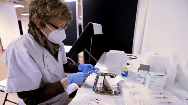 A nurse prepares a dose of the Pfizer-BioNTech Covid-19 vaccine in Cannes, France
