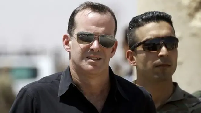 Mr McGurk (L) had previously said the US should retain a presence in Syria