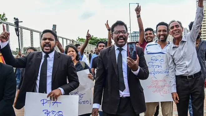 Lawyers and civil rights activists take part in a protest against the Prevention of Terrorism Act (PTA) law, which allows for the prolonged detention of suspects without trial, near the Presidential Secretariat in Colombo on October 10, 2022.