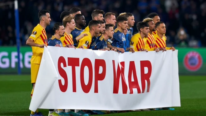 Barcelona and Napoli players showed a "Stop War" banner ahead of their Europa League match on 24 February