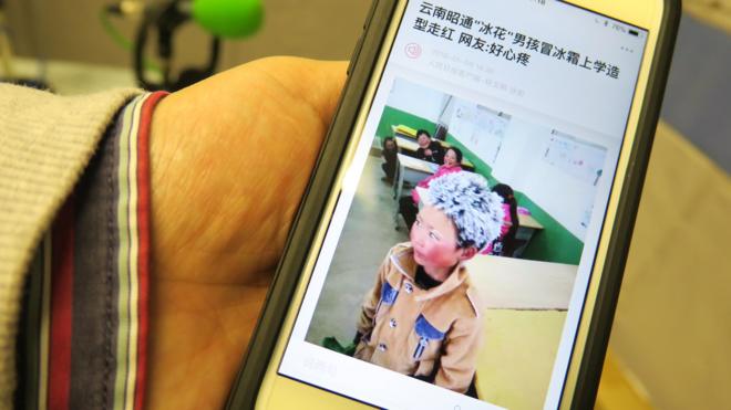 人民日報客戶端上刊登的「冰花男孩」王福滿照片（BBC中文網圖片12/1/2018）