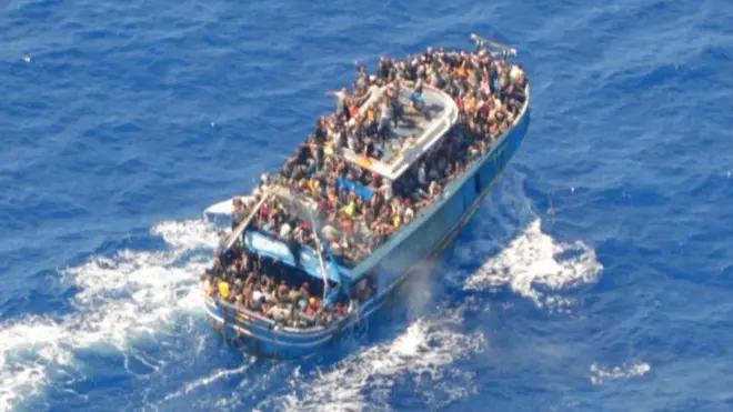 An aerial view of a migrant boat that sank in the Mediterranean with hundreds of migrants on board. The deck of the ship can be seen overcrowded with people