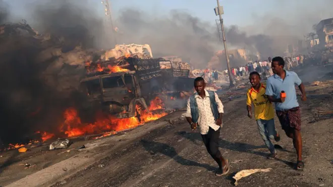Image shows civilians evacuating from the scene of an explosion in the Hodan district of Mogadishu, Somalia on 14 October 2017
