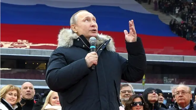 Russian President Vladimir Putin speaks during a campaign concert in March 2018