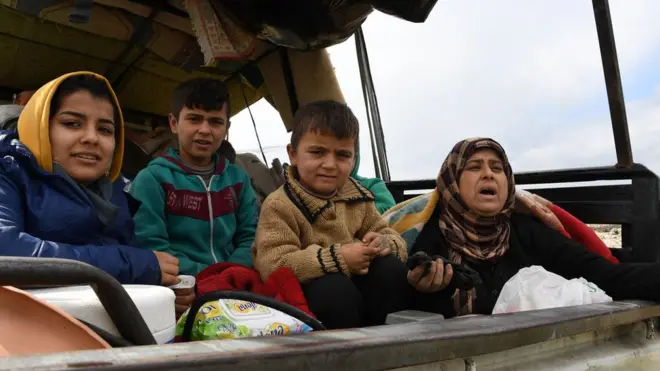 Civilians leave the Syrian city of Afrin, 15 March