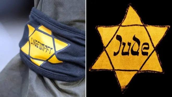 This Berlin protester wore a yellow star with the word "unvaccinated", mimicking the notorious badges the Nazis forced to wear in World War Two