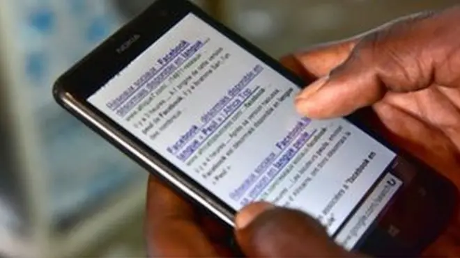 a hand scrolling through a smart phone