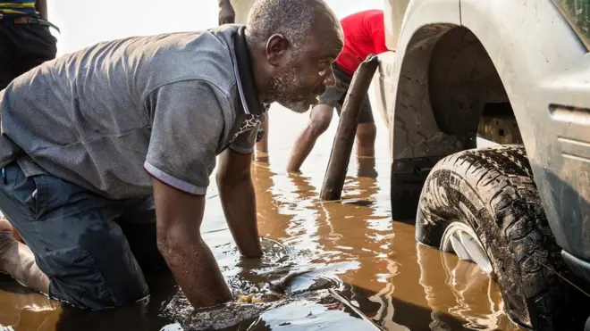 Eye surgeon Bruno Kandei is used to getting his car out of the mud when trying to get to rural areas