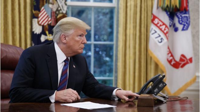 US President Donald J. Trump tries to connect the phone line with Mexican President Enrique Pena a Nieto to announce a trade deal in the Oval Office of the White House in Washington, DC, USA, 27 August 2018.