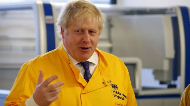 Prime Minister Boris Johnson visits a laboratory at the Public Health England National Infection Service in Colindale, north London, as the number of confirmed coronavirus cases in the UK rose.