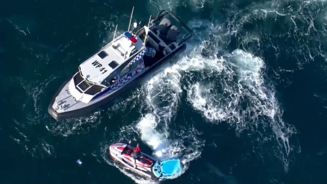Police patrol boats at the scene on Wednesday