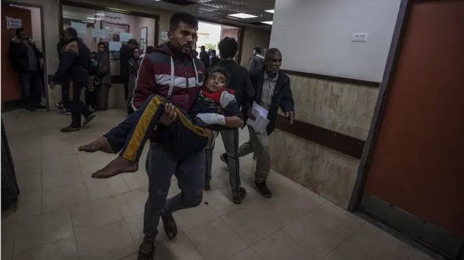Wounded people, including children, are brought to Al-Aqsa Martyrs Hospital for treatment following Israeli attacks in Deir al-Balah, Gaza on 4 January 2024
