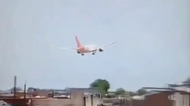 Air India passenger plane descends over neighbourhood