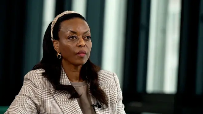 Former Nigerian minister of petroleum resources Diezani Alison-Madueke wear check suit ontop brown dress