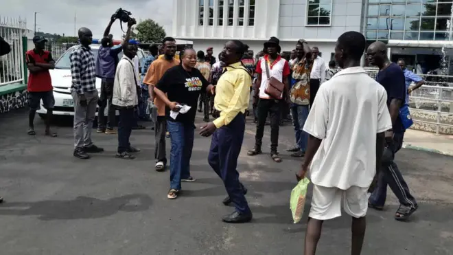 People gathered at the secretariat where the boy who was shot was taken to