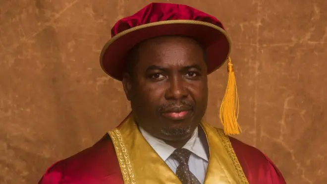 Man wit ceremonial cap for im head