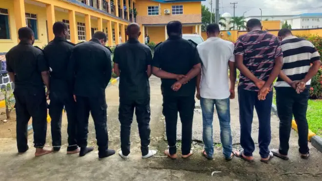Eight dismissed police officers wey dey on parade for di Police Headquarters for Port Harcourt