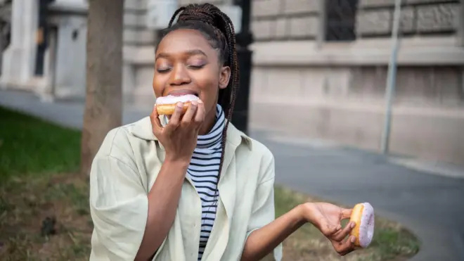 Woman eating sugary food