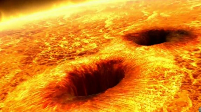 (ภาพจากฝีมือศิลปิน) จุดมืดบนดวงอาทิตย์เกิดจากสนามแม่เหล็กความเข้มสูงที่กักความร้อนเอาไว้ไม่ให้ออกสู่พื้นผิว