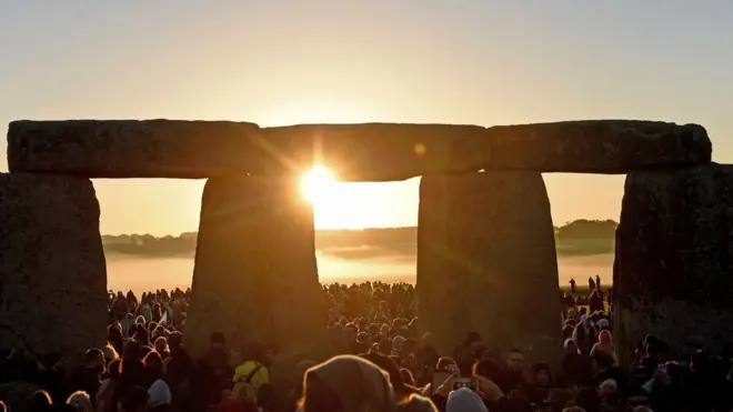 Visitors celebrate summer solstice and the dawn of the longest day of the year at Stonehenge on June 21, 2019 in Amesbury, England.