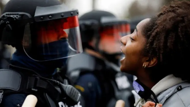 A demonstrator confronts police during a protest after Daunte Wright, was shot in Brooklyn Center, Minnesota, US