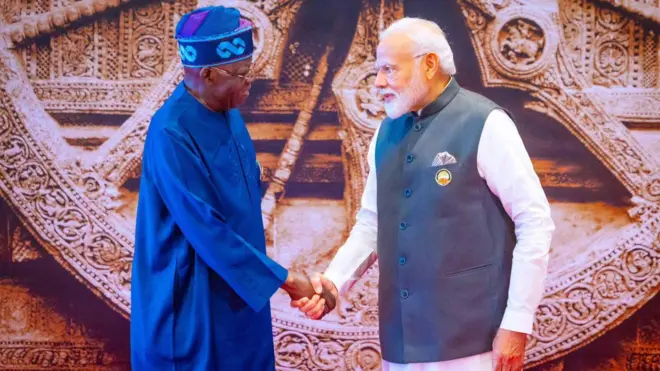 President Bola Tinubu shake hand wit PM Narendra Modi of India during di G20 summit for New Delhi, September 2023
