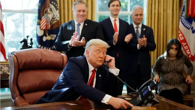 Donald Trump on the phone in the Oval Office